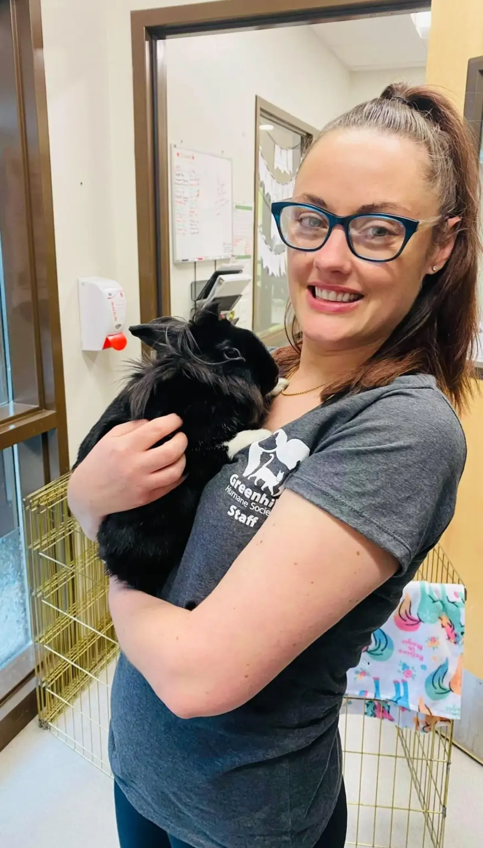 Sarah holding a rabbit at Greenhill Humane Society